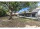 Expansive backyard featuring mature trees, offering ample space for outdoor activities and entertaining at 5092 Abagail Dr, Spring Hill, FL 34608