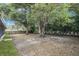 Large backyard with mature trees, new grass and wooden fences offering shade and privacy at 5092 Abagail Dr, Spring Hill, FL 34608