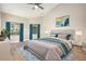 Bright bedroom offering large windows, ceiling fan, and a comfortable bed with stylish decor at 5092 Abagail Dr, Spring Hill, FL 34608