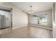 Dining area with large window and sleek modern lighting at 5092 Abagail Dr, Spring Hill, FL 34608