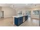 Open concept kitchen with large island, modern lighting, and ample natural light at 5092 Abagail Dr, Spring Hill, FL 34608