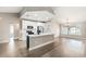 Open-concept kitchen with a large island, stainless steel appliances, and ample natural light at 5092 Abagail Dr, Spring Hill, FL 34608