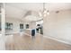 Open concept kitchen and living room with modern lighting at 5092 Abagail Dr, Spring Hill, FL 34608