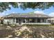 Charming single-story home featuring a screened-in porch and a spacious backyard with mature trees for ample shade at 5092 Abagail Dr, Spring Hill, FL 34608