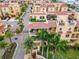 A lovely community features tropical landscaping, and multiple patios including a roof top area with chairs at 6412 Mayra Shores Ln, Apollo Beach, FL 33572
