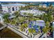 This restaurant with outdoor seating and blue umbrellas is located next to a marina at 6412 Mayra Shores Ln, Apollo Beach, FL 33572