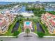 Luxury condos with a community pool, lush landscaping, and a marina nearby, offering a resort-style living experience at 6412 Mayra Shores Ln, Apollo Beach, FL 33572