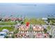 Beautiful condos with tile roofs are located in front of an empty lot with easy access to the bay at 6412 Mayra Shores Ln, Apollo Beach, FL 33572