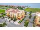 Stunning aerial view of yellow townhouses with red tile roofs near the water at 6412 Mayra Shores Ln, Apollo Beach, FL 33572