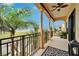 Relax in the fresh air from this spacious balcony with columns and views at 6412 Mayra Shores Ln, Apollo Beach, FL 33572