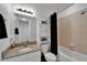 Standard bathroom with granite countertop, single sink, toilet and shower with curtain at 6412 Mayra Shores Ln, Apollo Beach, FL 33572