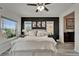 This well lit main bedroom features stylish decor, wood-look floors and bright, sunny windows at 6412 Mayra Shores Ln, Apollo Beach, FL 33572