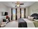 This comfortable bedroom features bright windows and dark-out curtains at 6412 Mayra Shores Ln, Apollo Beach, FL 33572