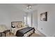 This bright bedroom features a ceiling fan, art and a single bed at 6412 Mayra Shores Ln, Apollo Beach, FL 33572