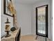 Inviting entryway with tiled floors, decorative console table, and stylish front door with blinds at 6412 Mayra Shores Ln, Apollo Beach, FL 33572
