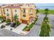 Beautiful yellow townhouses feature red tile roofs and meticulously maintained landscaping at 6412 Mayra Shores Ln, Apollo Beach, FL 33572