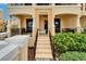 Attractive building exterior with a walkway, lush greenery, and private balconies at 6412 Mayra Shores Ln, Apollo Beach, FL 33572