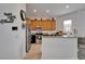 Kitchen featuring stainless steel appliances, wooden cabinets, and granite countertops at 6412 Mayra Shores Ln, Apollo Beach, FL 33572