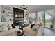 Inviting living room featuring built-in shelving, a fireplace, and sliding glass doors to the outside at 6412 Mayra Shores Ln, Apollo Beach, FL 33572