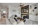 Cozy living room with comfortable seating, a fireplace, and built-in shelving at 6412 Mayra Shores Ln, Apollo Beach, FL 33572
