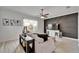 Living room showcasing modern accent wall, neutral-toned furniture, and ample natural light at 6412 Mayra Shores Ln, Apollo Beach, FL 33572