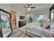 Serene main bedroom with water view, accent wall, and elegant decor at 6412 Mayra Shores Ln, Apollo Beach, FL 33572