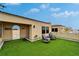 Roof deck with artificial grass, outdoor seating and views of the neighboring rooftops at 6412 Mayra Shores Ln, Apollo Beach, FL 33572
