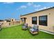 Roof deck featuring artificial grass, lounge seating and picturesque neighborhood views at 6412 Mayra Shores Ln, Apollo Beach, FL 33572