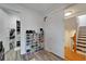 Spacious walk-in closet with shoe storage and access to staircase at 6412 Mayra Shores Ln, Apollo Beach, FL 33572