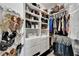 Organized walk-in closet featuring shelves, hanging racks, and ample storage space at 6412 Mayra Shores Ln, Apollo Beach, FL 33572