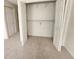 Bedroom closet featuring double doors, ample storage space with shelving and carpet at 6620 121St Ave # 1, Largo, FL 33773
