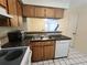Functional kitchen with stainless steel sink and countertop, offering an open view at 6620 121St Ave # 1, Largo, FL 33773