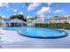 Large community pool with clear blue water, surrounded by a pool deck at 6620 121St Ave # 1, Largo, FL 33773