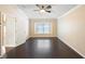 Neutral bedroom featuring a ceiling fan, crown molding, and hardwood floors at 6914 Monarch Park Dr, Apollo Beach, FL 33572