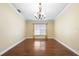 Inviting dining room with hardwood floors and a window providing plenty of natural light at 6914 Monarch Park Dr, Apollo Beach, FL 33572