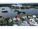 Aerial view of a waterfront single-story home near a river with lush foliage at 800 Chesapeake Dr # 23, Tarpon Springs, FL 34689