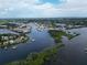 Expansive aerial view of a bay area with boats, islands, and homes at 800 Chesapeake Dr # 23, Tarpon Springs, FL 34689