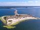 Aerial view of an island community, bridge, and clear coastal waters at 800 Chesapeake Dr # 23, Tarpon Springs, FL 34689