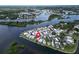 Stunning aerial shot of a waterfront community with homes nestled along the coastline and interconnected waterways at 800 Chesapeake Dr # 23, Tarpon Springs, FL 34689