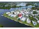 Panoramic aerial view of a waterfront community with single-story homes and docks on the water at 800 Chesapeake Dr # 23, Tarpon Springs, FL 34689