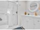 Bathroom featuring a shower, a white vanity, and decorative mirror at 800 Chesapeake Dr # 23, Tarpon Springs, FL 34689