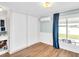 Bedroom with barn door closure and water views at 800 Chesapeake Dr # 23, Tarpon Springs, FL 34689