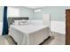Comfortable bedroom featuring a soft grey headboard and lots of natural light at 800 Chesapeake Dr # 23, Tarpon Springs, FL 34689