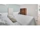 Bedroom with a comfortable bed, neutral wall color, and traditional wooden dresser at 800 Chesapeake Dr # 23, Tarpon Springs, FL 34689