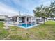 Charming home exterior with a covered patio, blue deck, and well-maintained lawn at 800 Chesapeake Dr # 23, Tarpon Springs, FL 34689