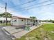 Inviting single-story home with a covered porch and updated landscaping near a waterfront view at 800 Chesapeake Dr # 23, Tarpon Springs, FL 34689