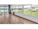 Enclosed lanai featuring wood flooring, lots of natural light and views of the water at 800 Chesapeake Dr # 23, Tarpon Springs, FL 34689