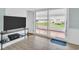 Cozy living room featuring sliding doors with access to an outdoor space at 800 Chesapeake Dr # 23, Tarpon Springs, FL 34689