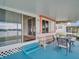 Covered patio with outdoor seating area and scenic views of the surrounding waterfront at 800 Chesapeake Dr # 23, Tarpon Springs, FL 34689