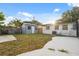 Backyard with a shed, grass, and concrete slab at 8256 Lark St, Seminole, FL 33777
